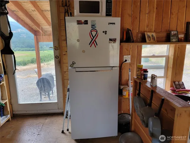 a living room with fireplace furniture and a flat screen tv