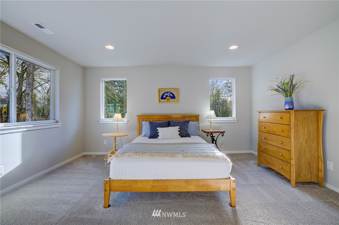 4792 Smithers Avenue South Renton, WA 98055 - Photo 23 of 37 a bed sitting in a bedroom next to a window