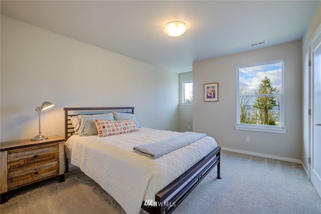 4792 Smithers Avenue South Renton, WA 98055 - Photo 29 of 37 a bedroom with a bed and a window
