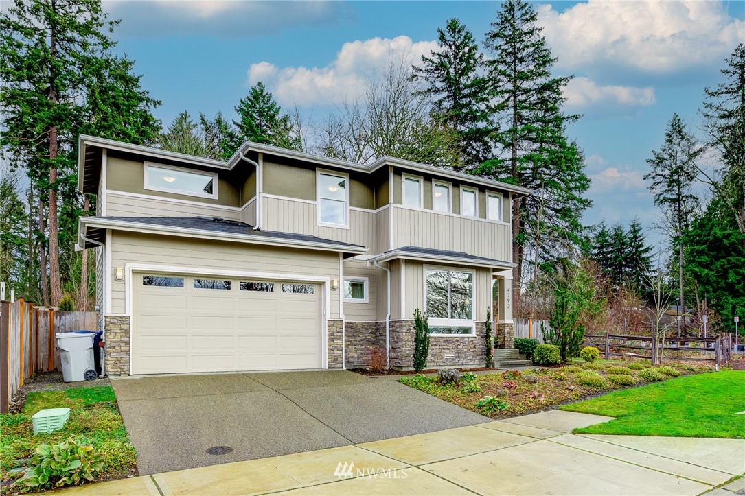 4792 Smithers Avenue South Renton, WA 98055 - Photo 37 of 37 a front view of a house with a yard and garage