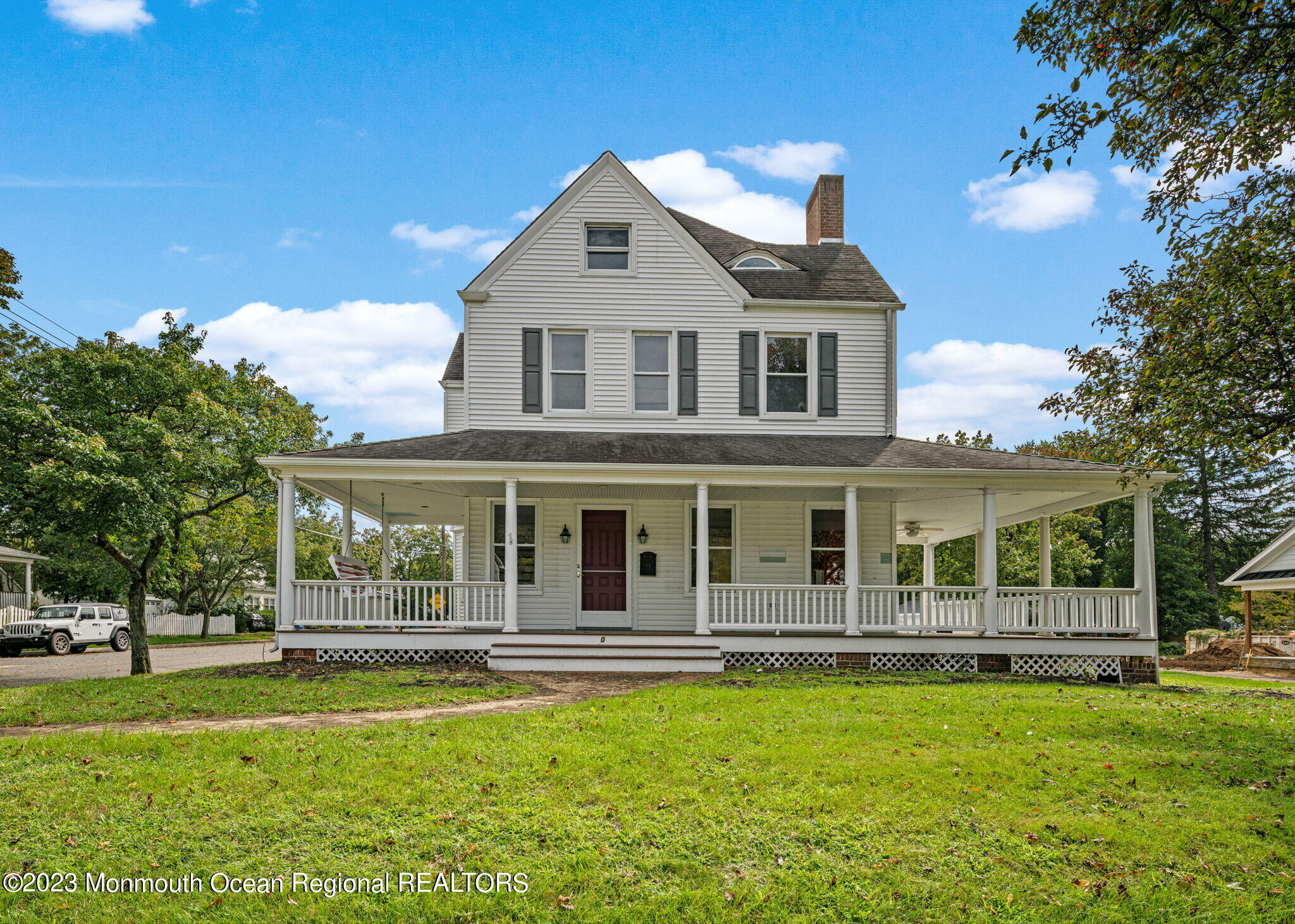 420 River Road Fair Haven, NJ 07704 - Photo 1 of 34 a front view of a house with a garden