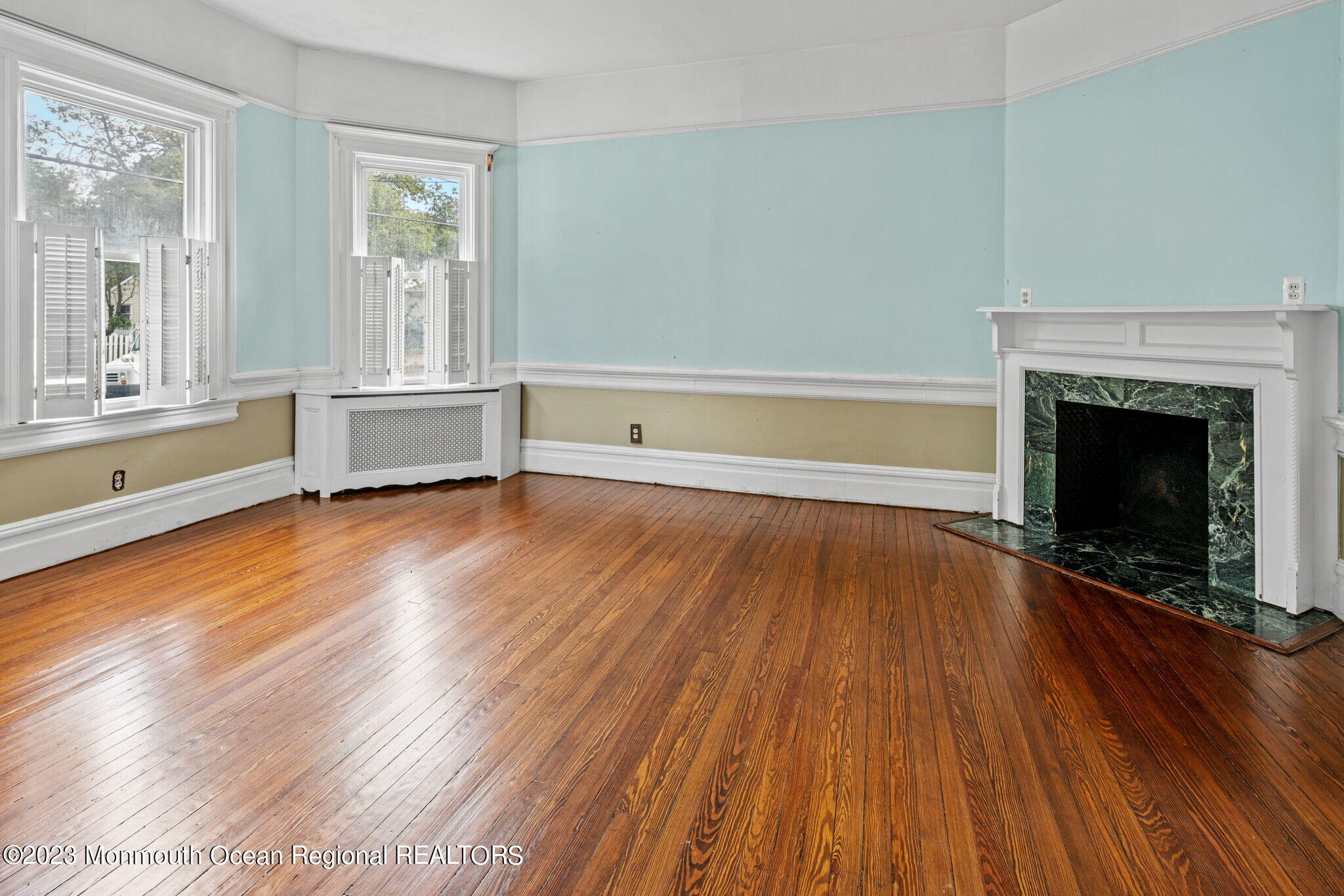 420 River Road Fair Haven, NJ 07704 - Photo 11 of 34 wooden floor fireplace and windows in an empty room