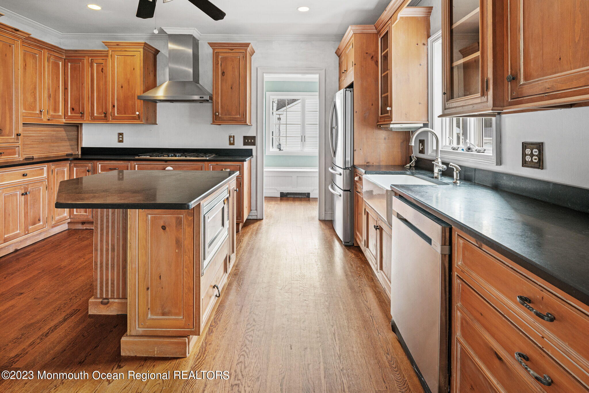 420 River Road Fair Haven, NJ 07704 - Photo 15 of 34 a kitchen with stainless steel appliances granite countertop a lot of counter space and wooden floors