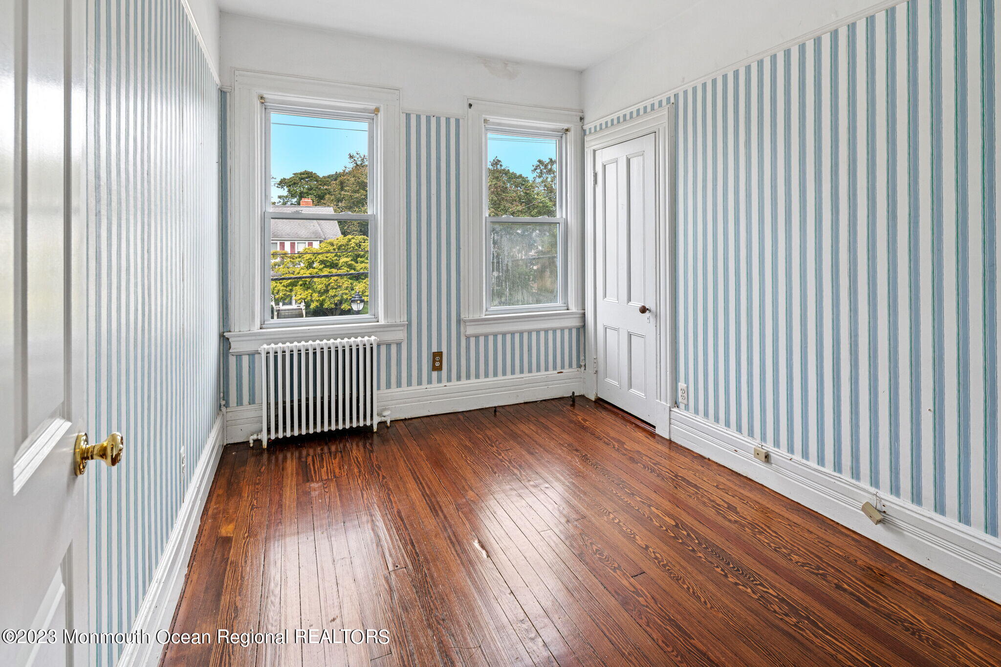 420 River Road Fair Haven, NJ 07704 - Photo 21 of 34 an empty room with wooden floor and windows