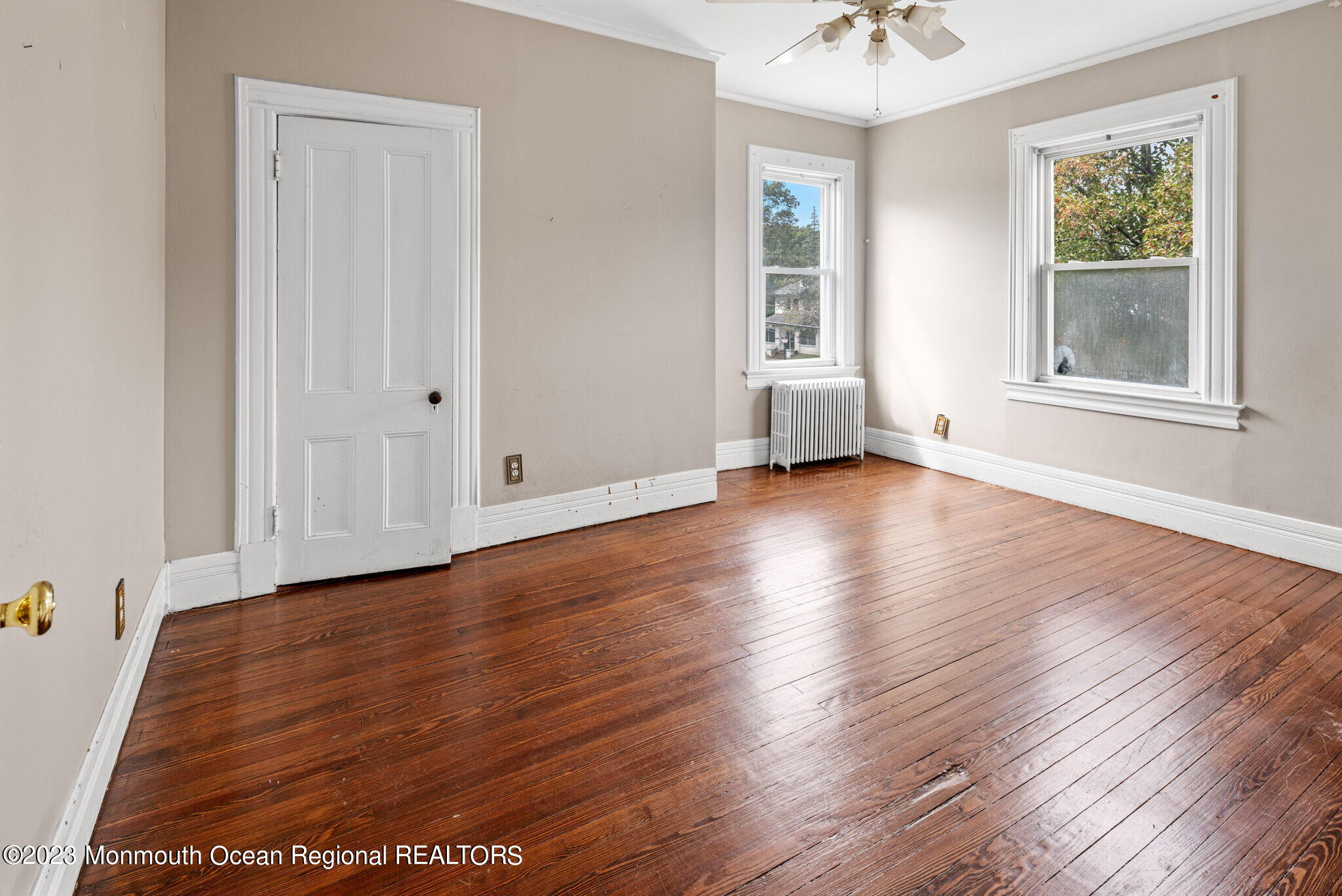 420 River Road Fair Haven, NJ 07704 - Photo 22 of 34 an empty room with wooden floor and windows