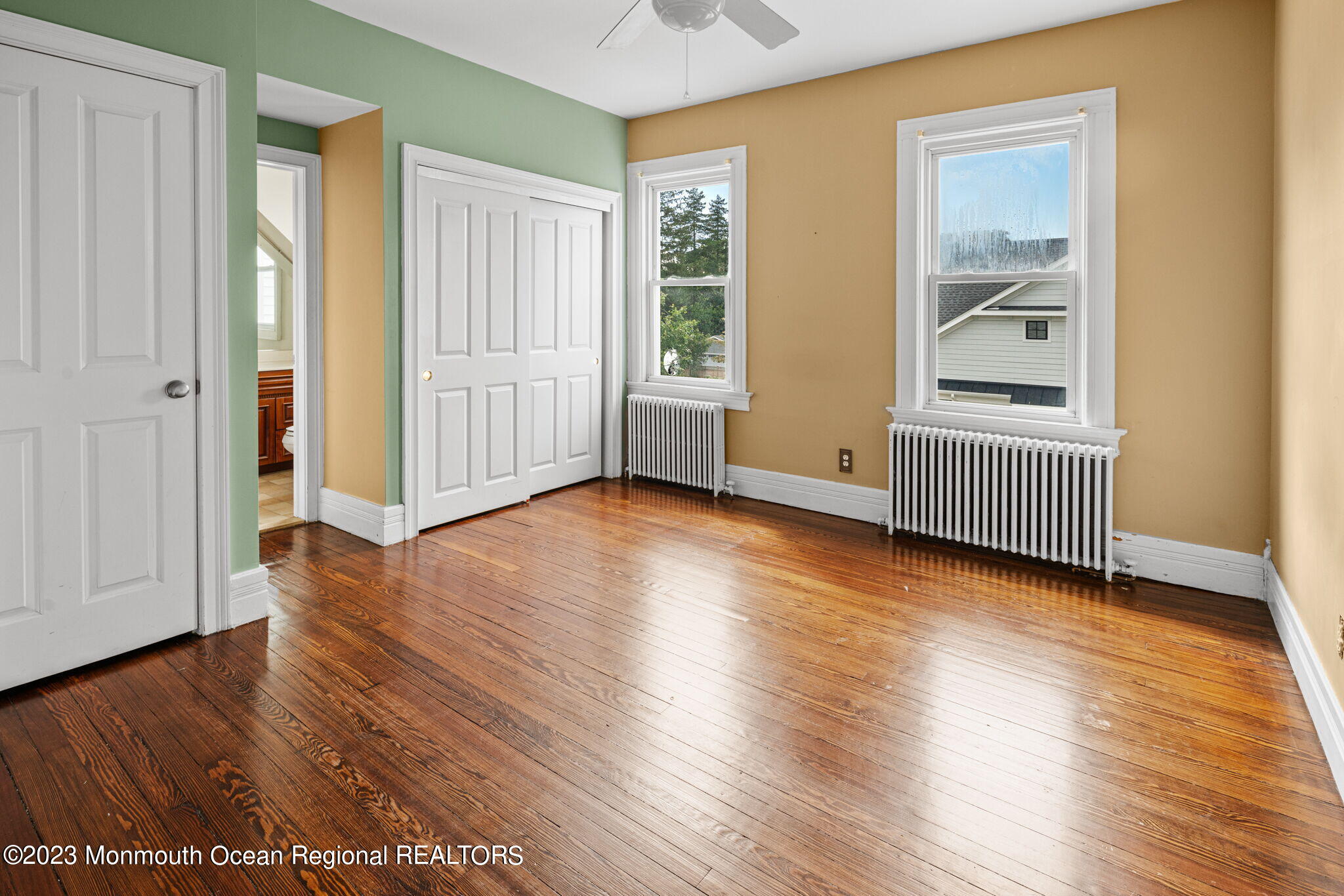 420 River Road Fair Haven, NJ 07704 - Photo 24 of 34 an empty room with wooden floor and windows