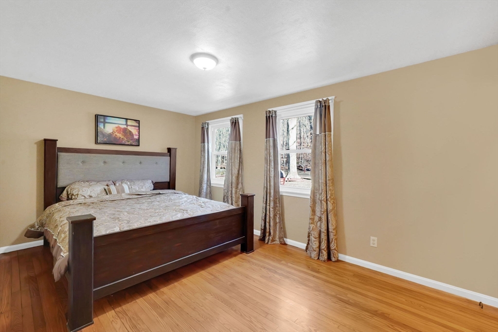 20 Old Orchard Road Wilbraham, MA 01095 - Photo 16 of 40 a bedroom with a bed and a painting on the wall