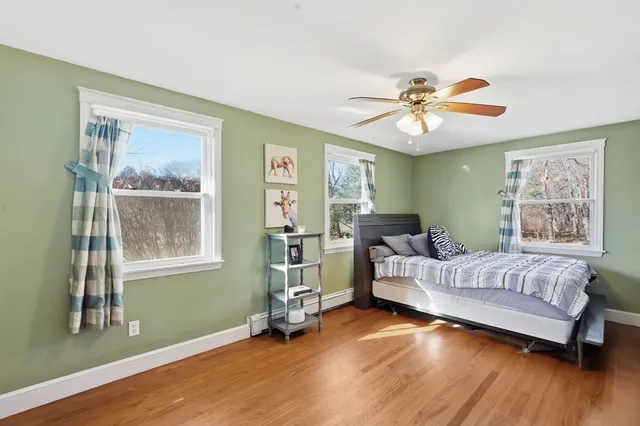 a bedroom with furniture and a window