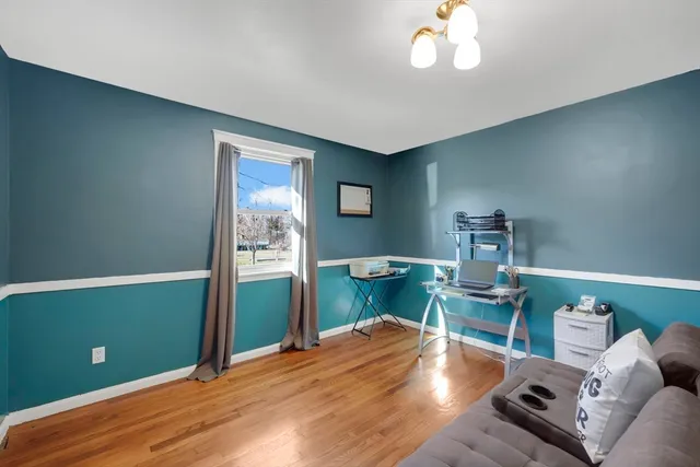 a view of a livingroom with furniture and a window