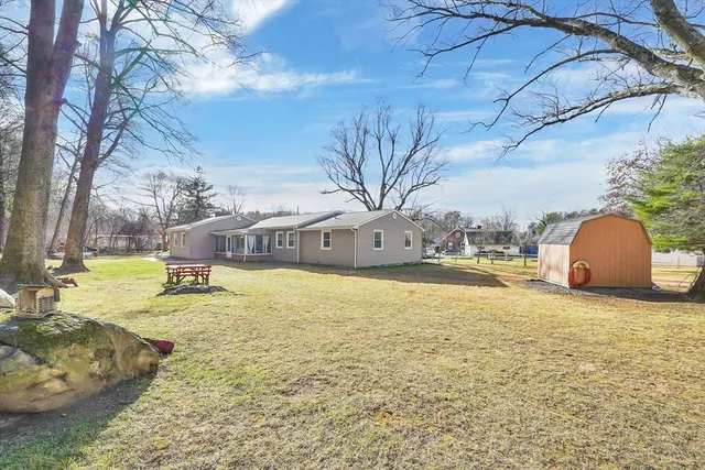 a view of a pool with a yard