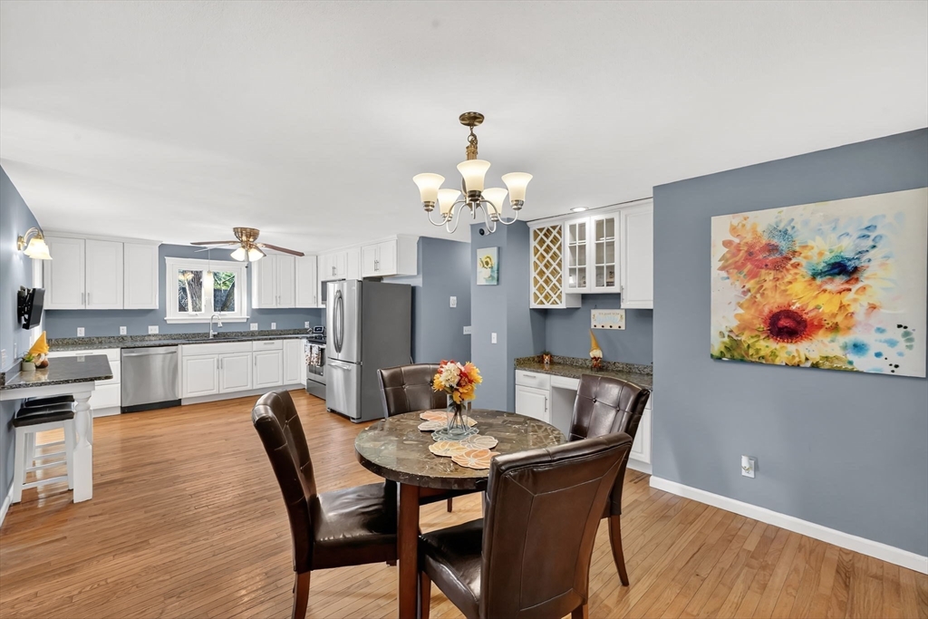 20 Old Orchard Road Wilbraham, MA 01095 - Photo 6 of 40 a dining room with furniture a rug and wooden floor