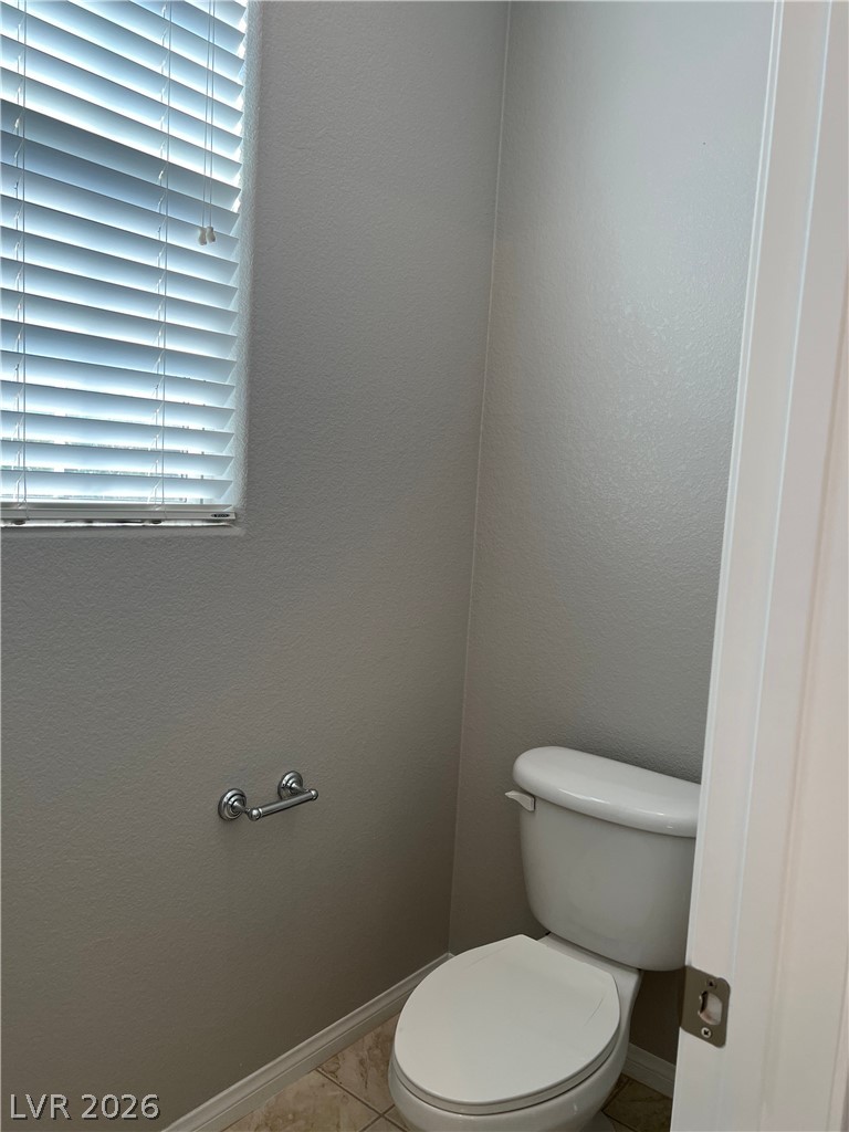 5981 Honeysuckle Ridge Street Las Vegas, NV 89148 - Photo 8 of 29 A well-maintained powder room, ready for personal touches.