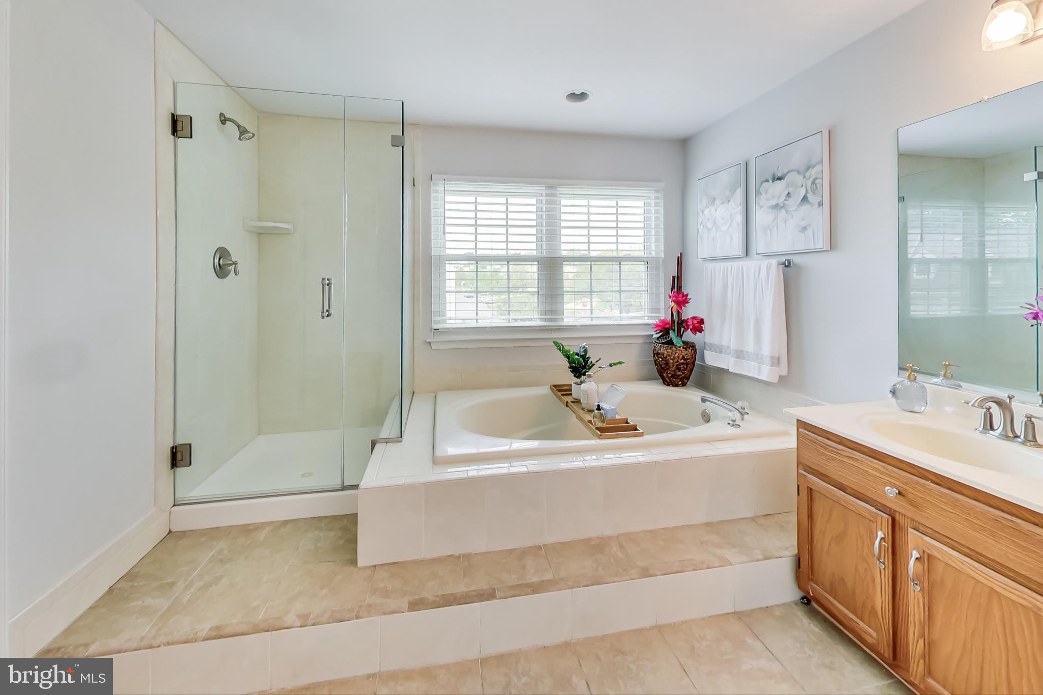 5312 Hever Way Frederick, MD 21703 - Photo 11 of 36 a bathroom with a tub sink shower and mirror
