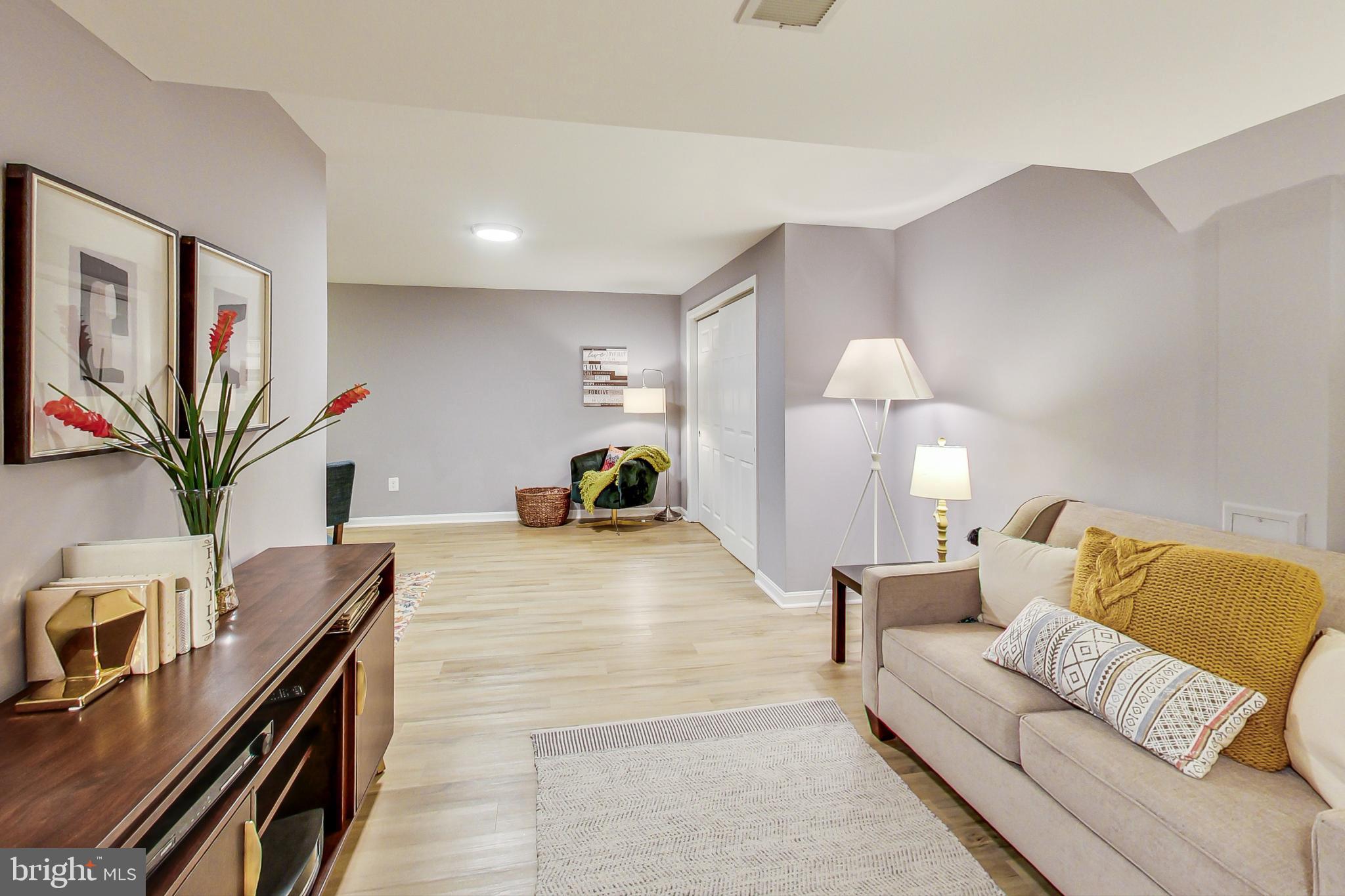 5312 Hever Way Frederick, MD 21703 - Photo 14 of 36 a living room with furniture and a flat screen tv