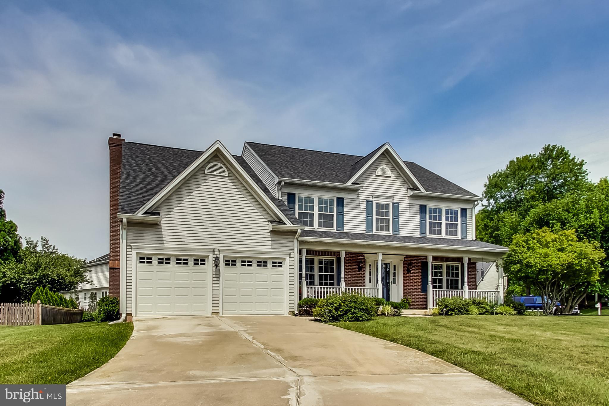 5312 Hever Way Frederick, MD 21703 - Photo 16 of 36 a front view of a house with a yard and potted plants