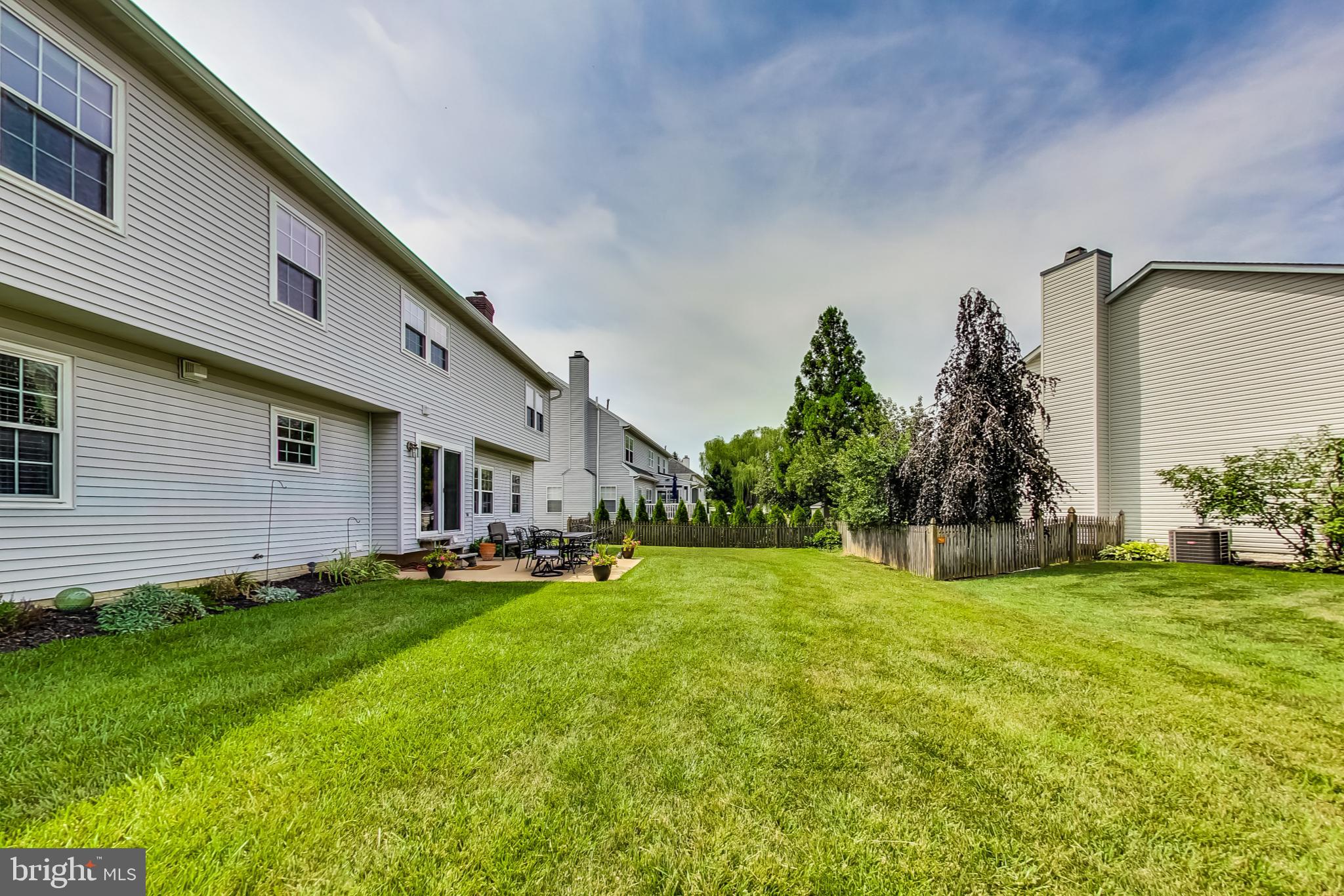 5312 Hever Way Frederick, MD 21703 - Photo 21 of 36 a backyard of a house with table and chairs