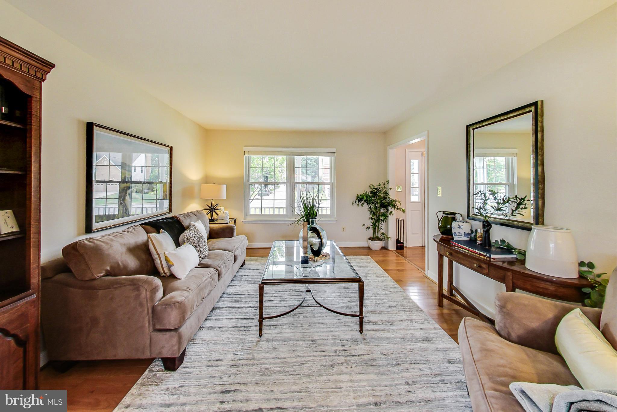 5312 Hever Way Frederick, MD 21703 - Photo 6 of 36 a living room with furniture and a wooden floor