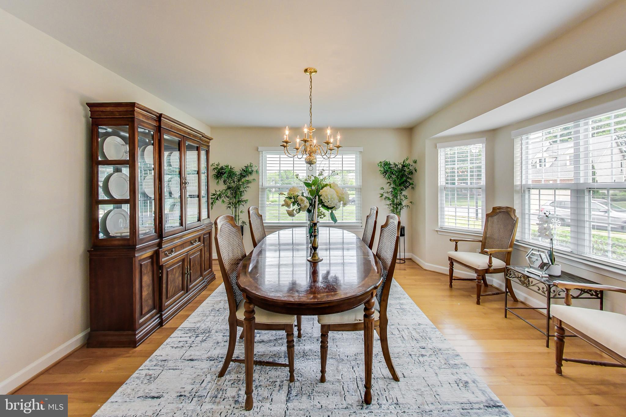 5312 Hever Way Frederick, MD 21703 - Photo 7 of 36 a dining room with furniture a chandelier and wooden floor