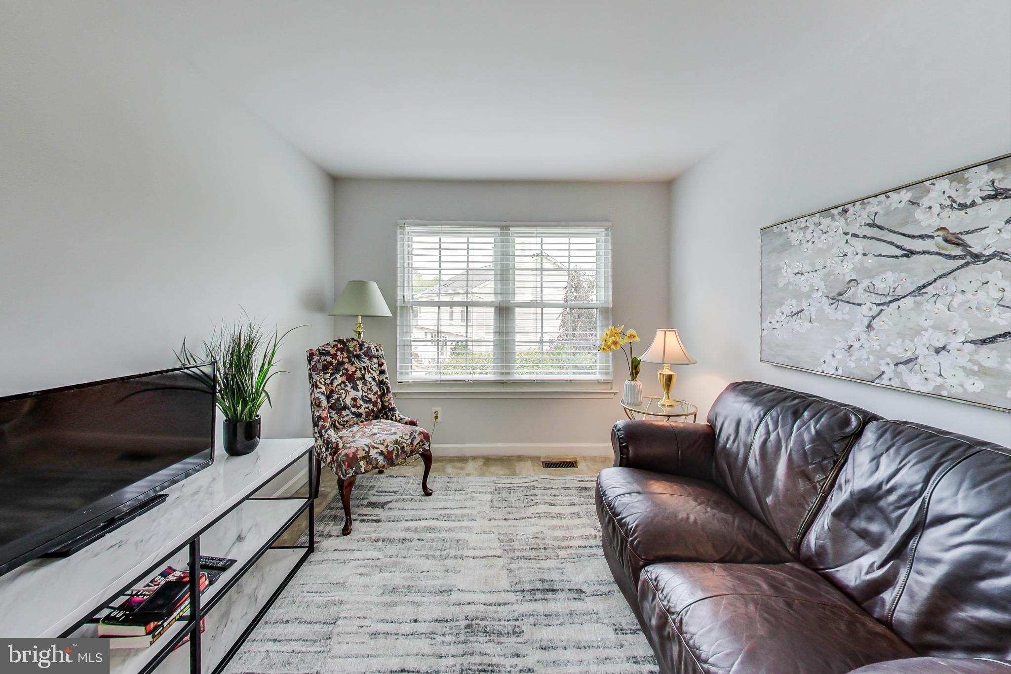 5312 Hever Way Frederick, MD 21703 - Photo 9 of 36 a living room with furniture and a flat screen tv