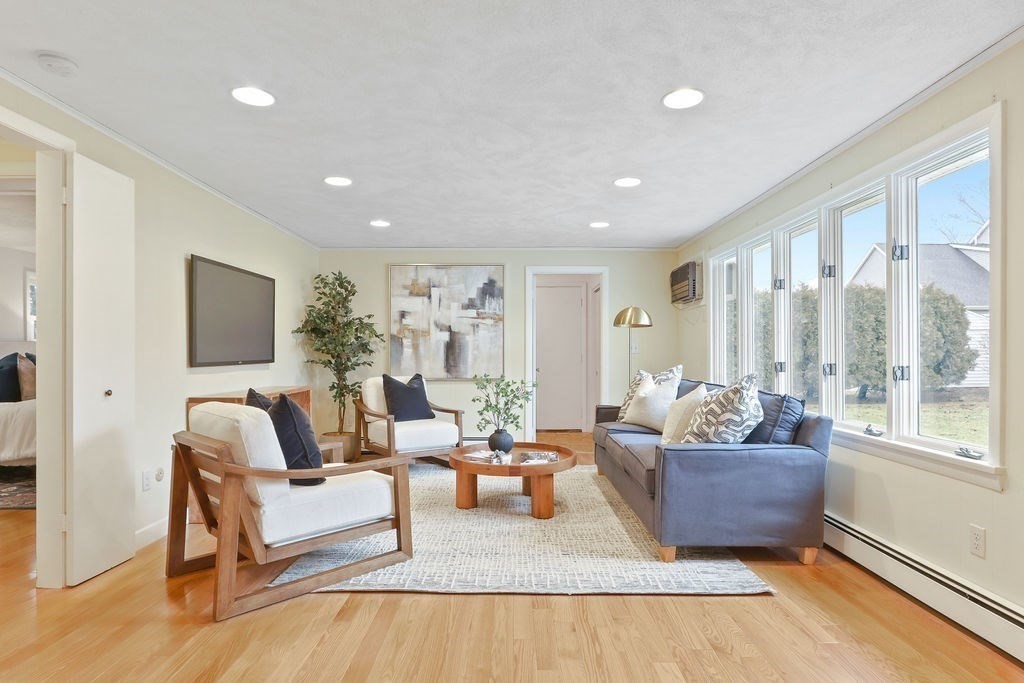 13 Wentworth Road Natick, MA 01760 - Photo 15 of 33 a living room with furniture and a flat screen tv