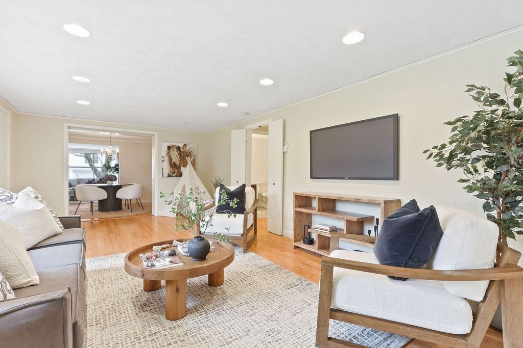13 Wentworth Road Natick, MA 01760 - Photo 16 of 33 a living room with furniture and a flat screen tv