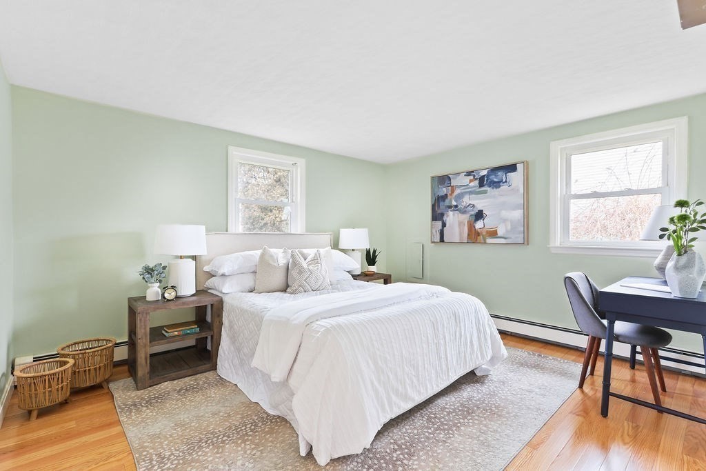 13 Wentworth Road Natick, MA 01760 - Photo 20 of 33 a bedroom with a bed and a table in it