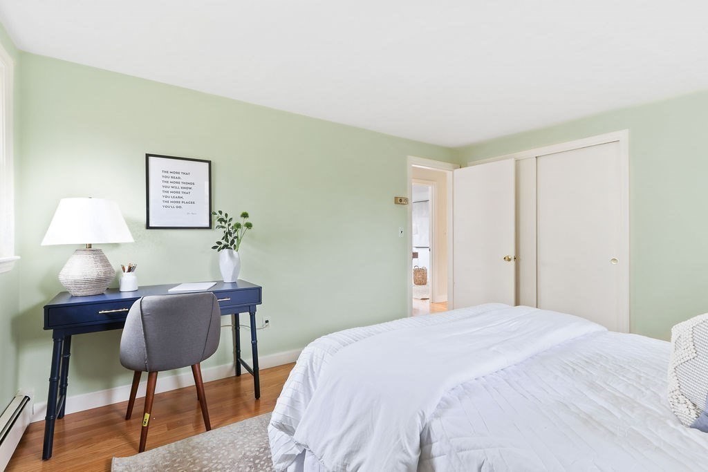 13 Wentworth Road Natick, MA 01760 - Photo 21 of 33 a bedroom with a bed and a lamp on table