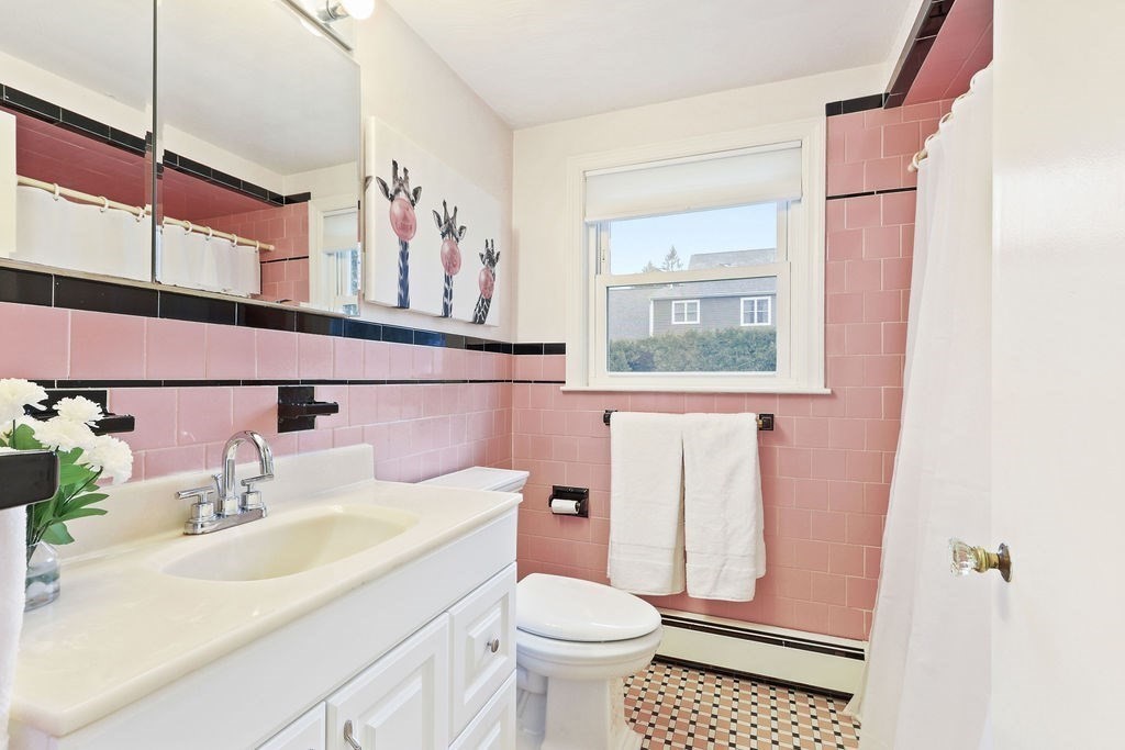 13 Wentworth Road Natick, MA 01760 - Photo 24 of 33 a bathroom with a sink a toilet and shower curtain