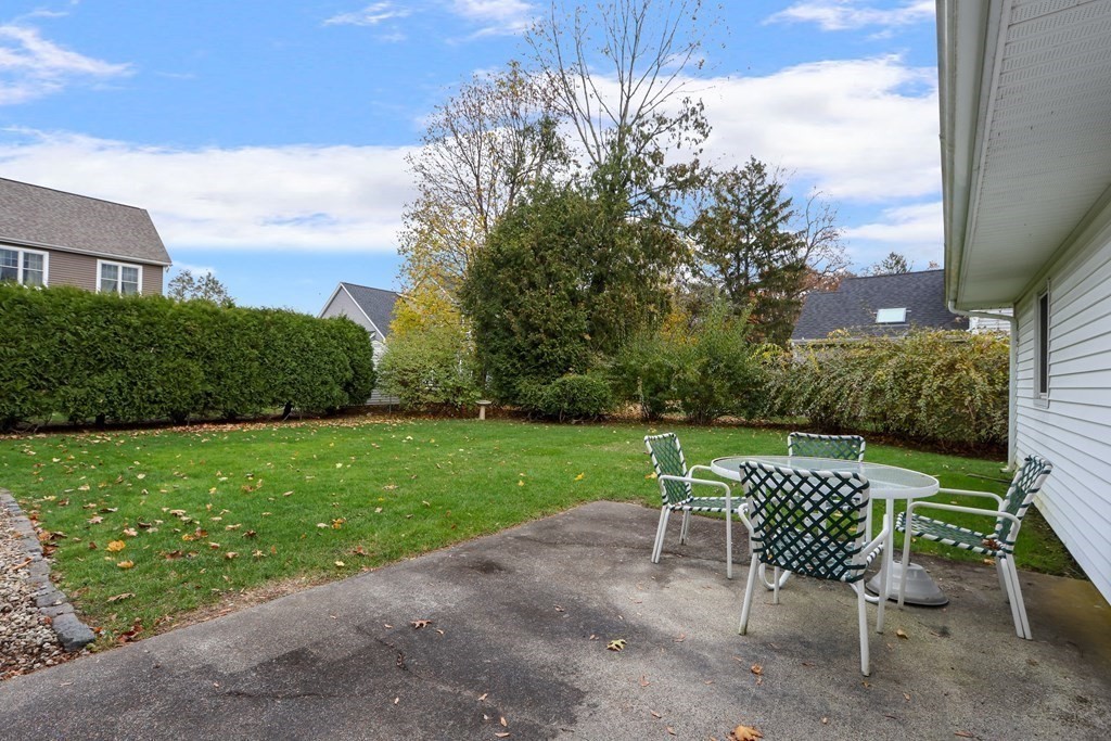 13 Wentworth Road Natick, MA 01760 - Photo 28 of 33 a view of a chair and table on the garden