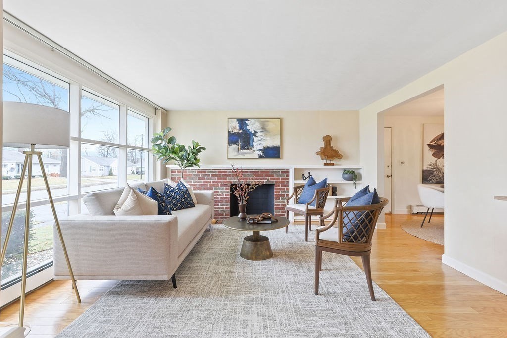 13 Wentworth Road Natick, MA 01760 - Photo 5 of 33 a living room with furniture and a fireplace