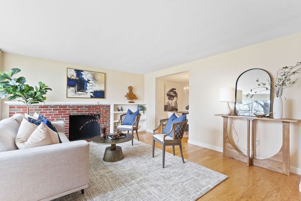 13 Wentworth Road Natick, MA 01760 - Photo 7 of 33 a living room with furniture a rug and a fireplace