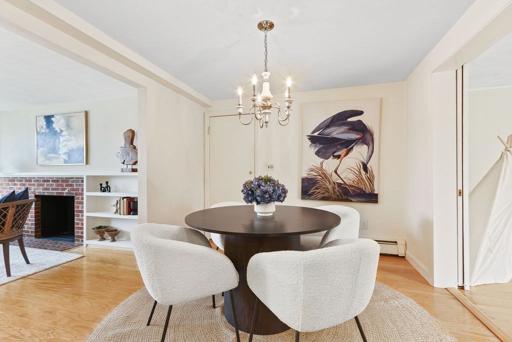 13 Wentworth Road Natick, MA 01760 - Photo 9 of 33 a dining room with furniture a chandelier and wooden floor