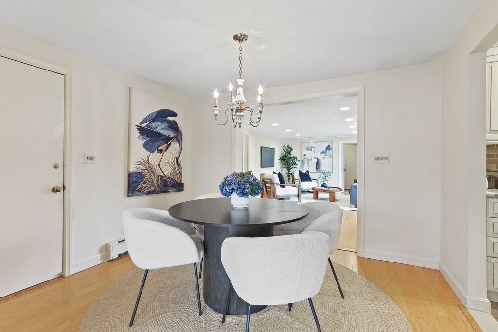 13 Wentworth Road Natick, MA 01760 - Photo 10 of 33 a dining room with furniture and chandelier