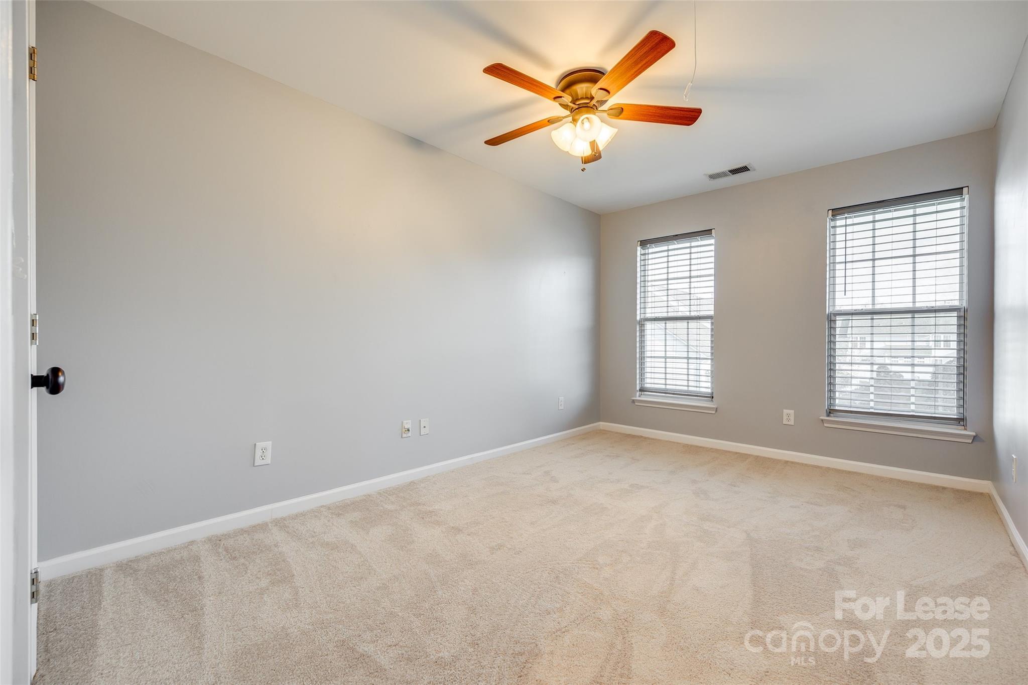 618 Bayou Circle Clover, SC 29710 - Photo 16 of 29 an empty room with windows and fan