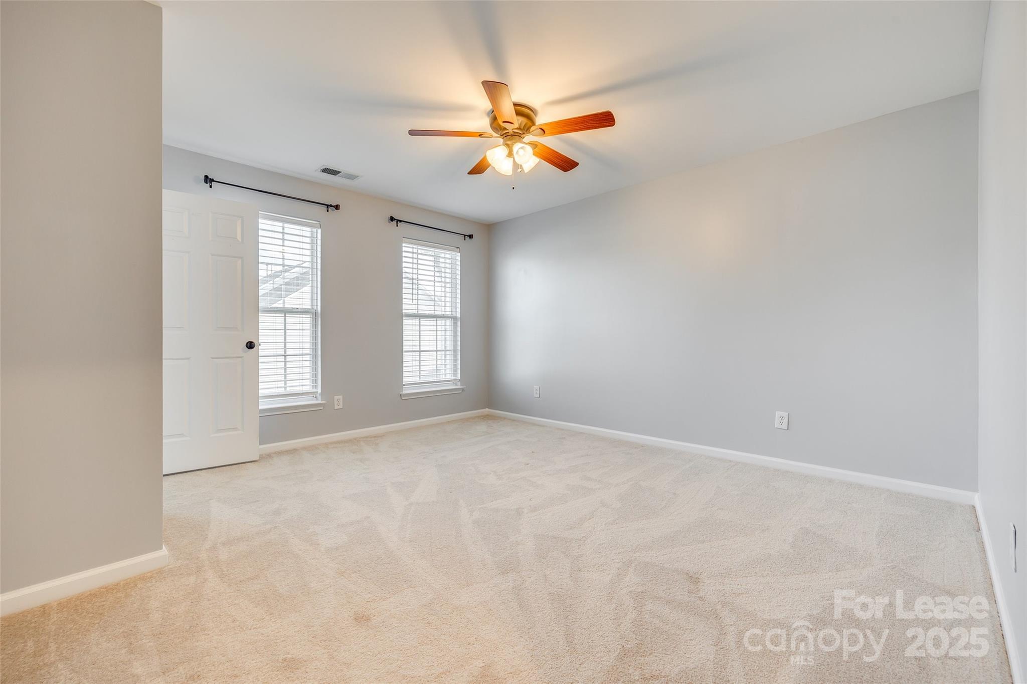 618 Bayou Circle Clover, SC 29710 - Photo 18 of 29 an empty room with windows and fan