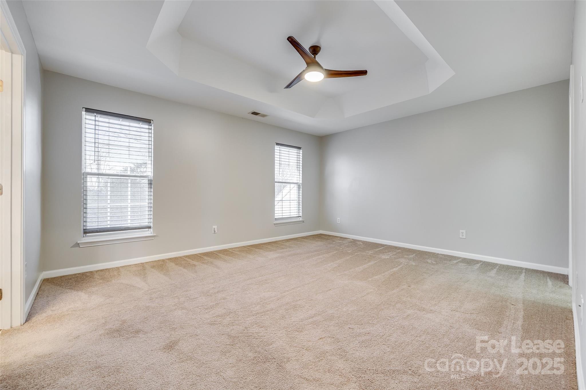 618 Bayou Circle Clover, SC 29710 - Photo 21 of 29 an empty room with windows and ceiling fan