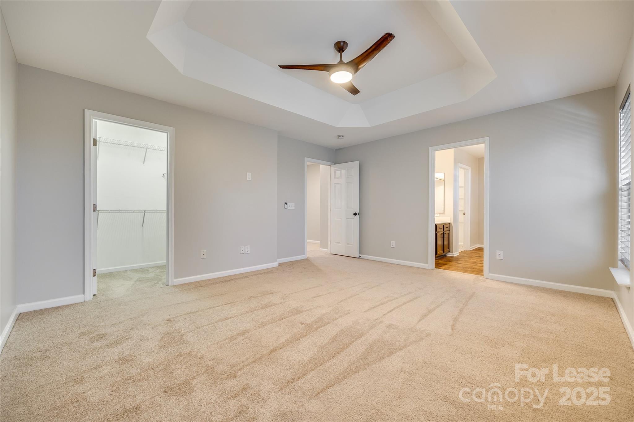 618 Bayou Circle Clover, SC 29710 - Photo 22 of 29 an empty room with ceiling fan and windows