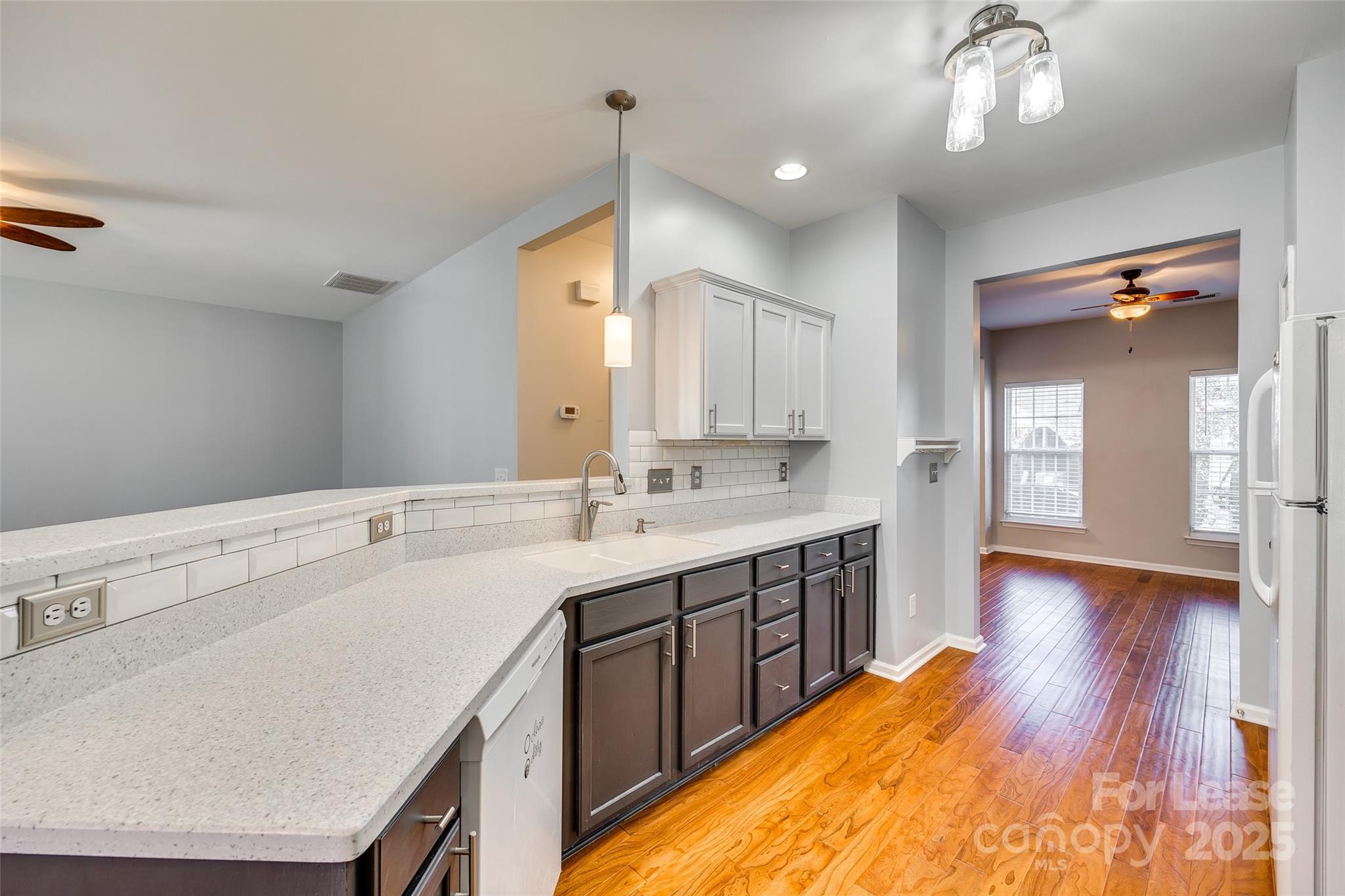 618 Bayou Circle Clover, SC 29710 - Photo 9 of 29 a large kitchen with a sink and wooden floor