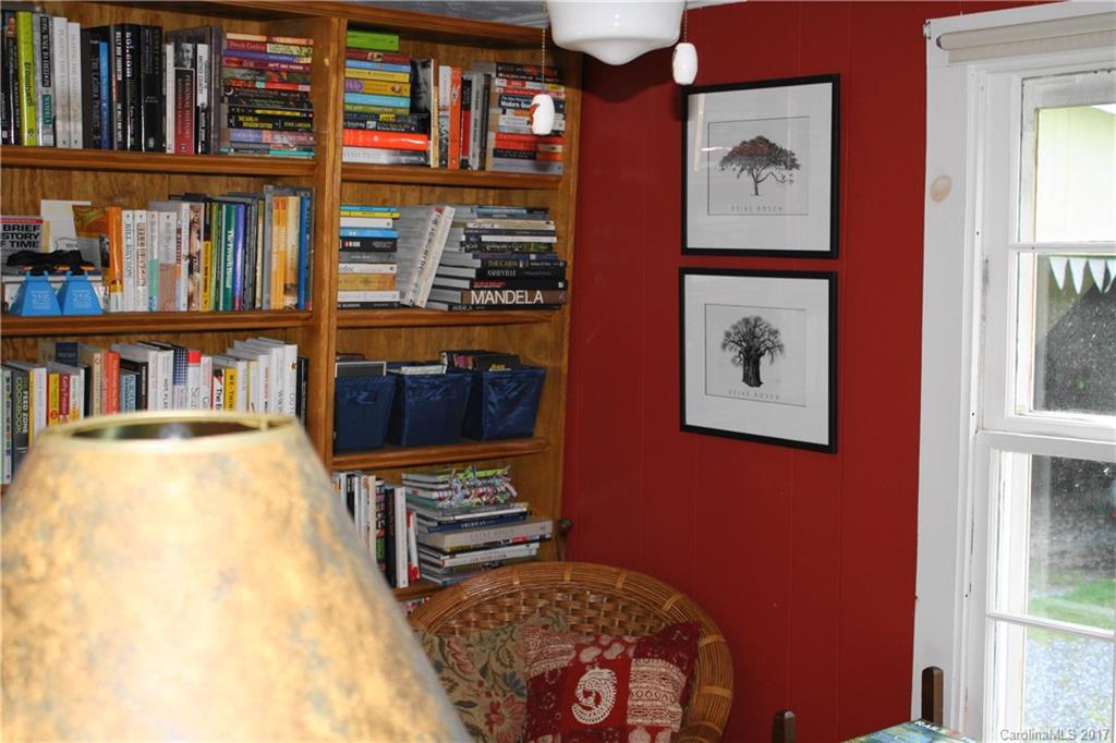 1335 White Oak Road Marshall, NC 28753 - Photo 16 of 24 a room with furniture and a book shelf