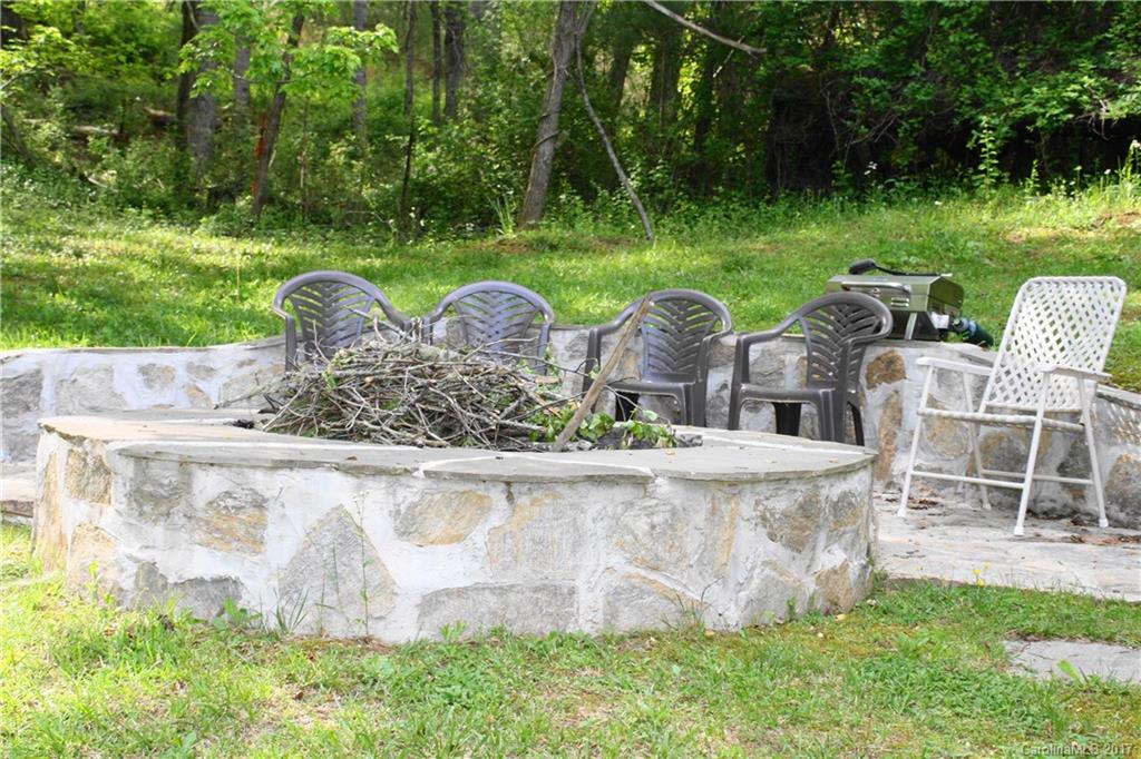 1335 White Oak Road Marshall, NC 28753 - Photo 19 of 24 front view of a house with a yard table and chairs