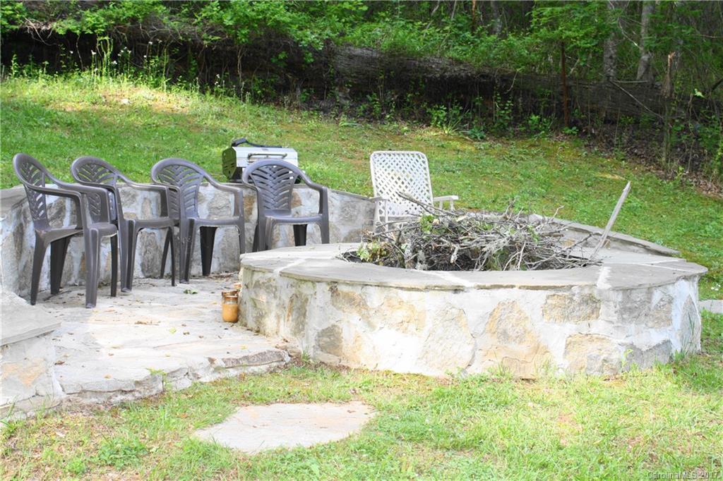 1335 White Oak Road Marshall, NC 28753 - Photo 20 of 24 a view of a garden with a fountain