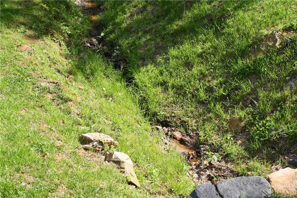1335 White Oak Road Marshall, NC 28753 - Photo 24 of 24 a backyard of a house with lots of green space