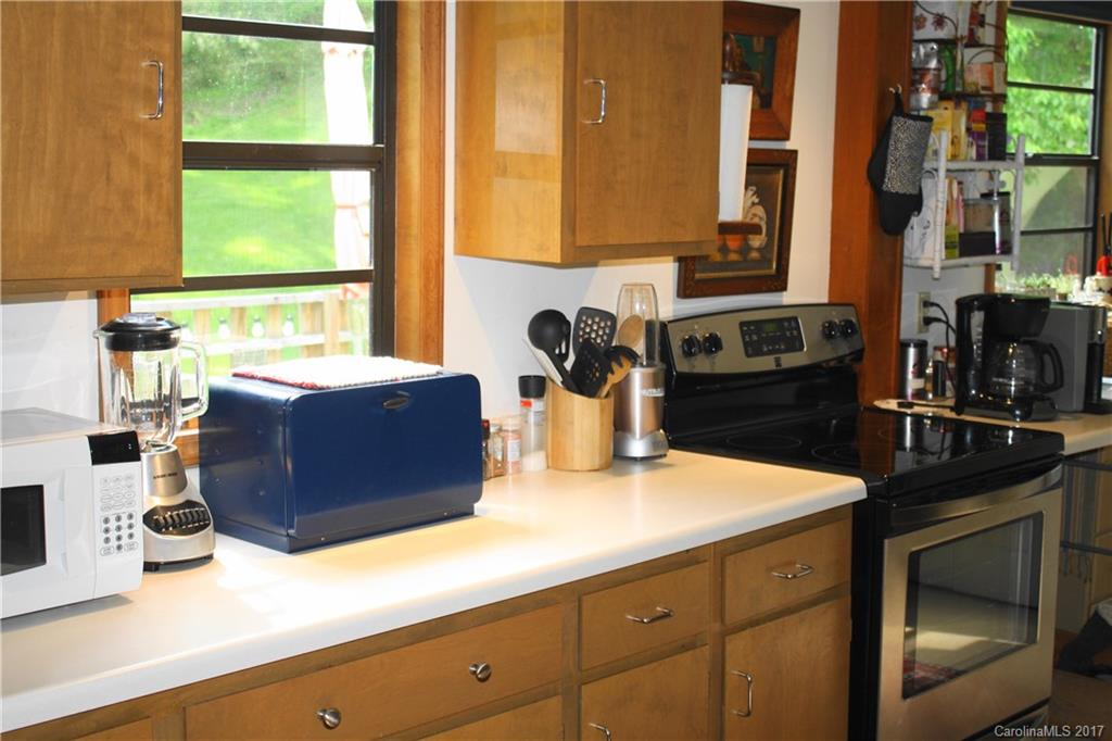 1335 White Oak Road Marshall, NC 28753 - Photo 8 of 24 a kitchen with a sink and a window