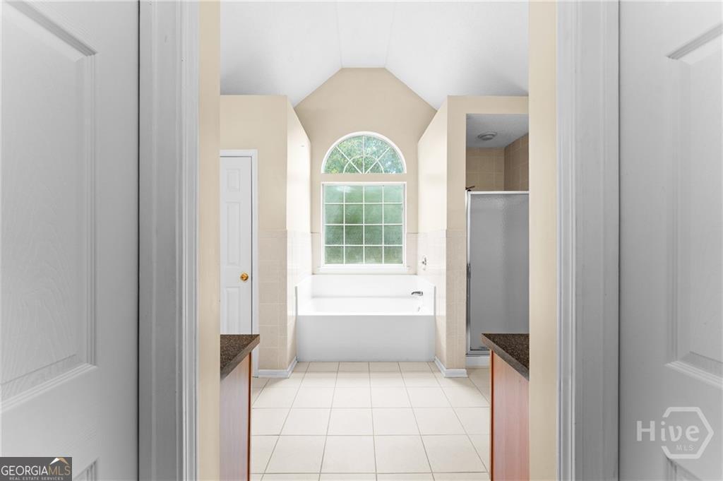 10 Fox Hound Court Pooler, GA 31322 - Photo 24 of 32 a bathroom with a bathtub and a window
