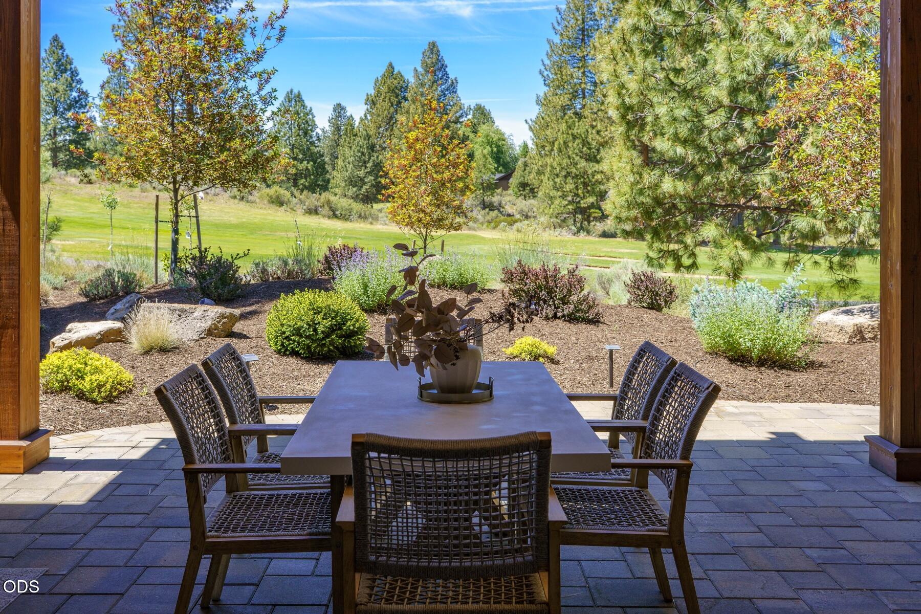 a view of a chairs and table in patio