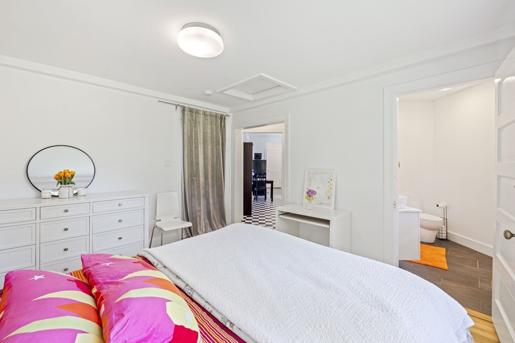 25 Somerset Road, Unit 2 Lexington, MA 02420 - Photo 11 of 17 a bedroom with a bed and a dresser