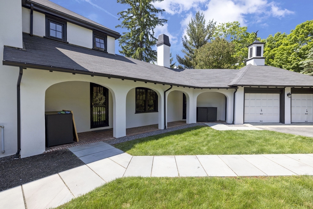 25 Somerset Road, Unit 2 Lexington, MA 02420 - Photo 17 of 17 a front view of a house with a garden and yard