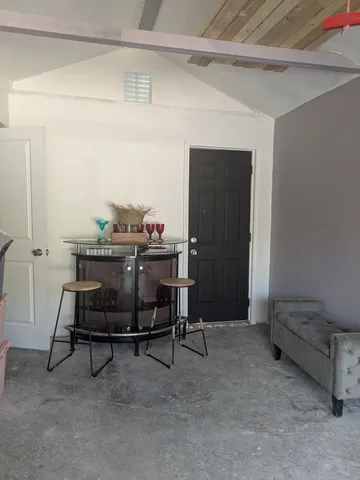 a view of a garage with a table and chairs