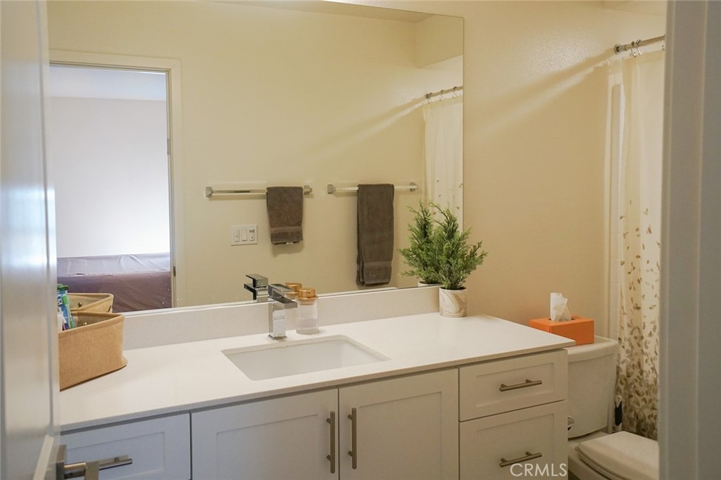 1976 Orchard Drive Placentia, CA 92870 - Photo 22 of 26 a bathroom with a sink and a mirror
