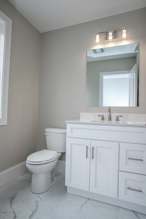 49 Spectacle Hill Road Bolton, MA 01740 - Photo 21 of 42 a bathroom with a toilet sink and mirror